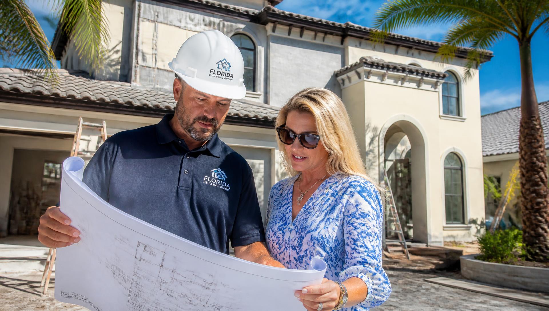 Contractor reviewing plans with a homeowner